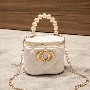 Elegant White Quilted Bag with Pearl Handle